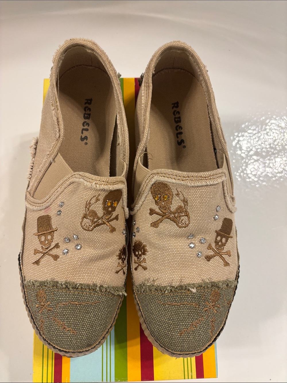 Rebels Beige Canvas Slip-On Shoes with Skull Embroidery and Crystal Accents